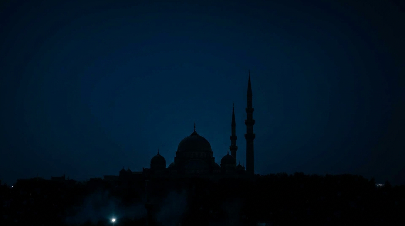 Mosque silhouette under a moonlit sky